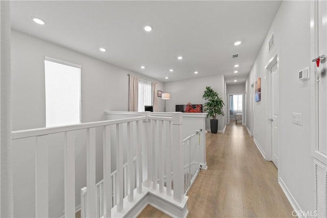 27218 Narrowleaf Willow Ln, Valencia, CA 91381 - hall with an upstairs landing, light wood-type flooring, and recessed lighting