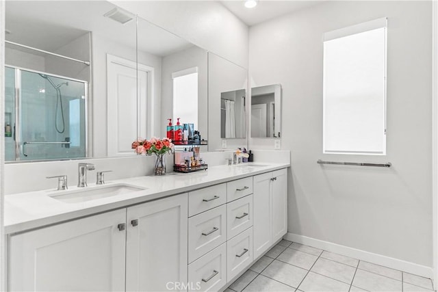 27218 Narrowleaf Willow Ln, Valencia, CA 91381 - bathroom with a stall shower, baseboards, tile patterned floors, and double vanity