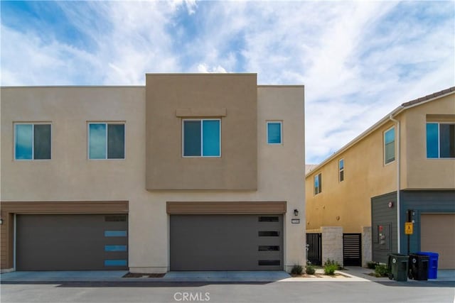 27218 Narrowleaf Willow Ln, Valencia, CA 91381 - view of front facade with an attached garage and stucco siding