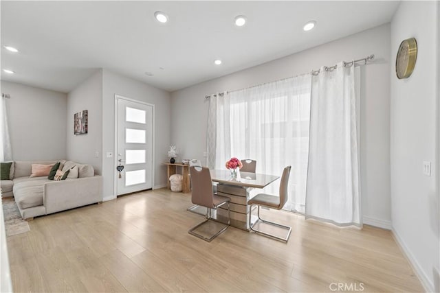 27218 Narrowleaf Willow Ln, Valencia, CA 91381 - dining space featuring light wood-style flooring, recessed lighting, and baseboards