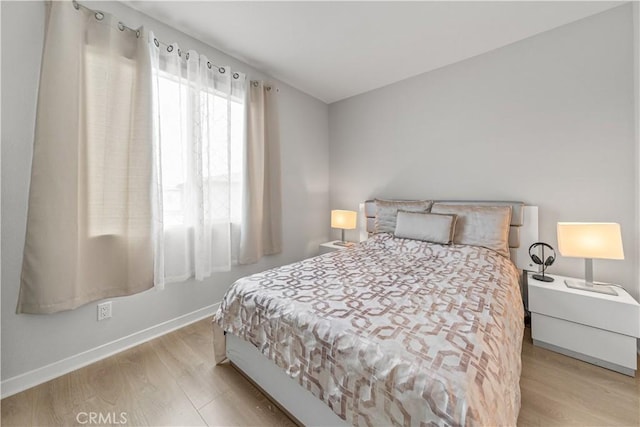 27218 Narrowleaf Willow Ln, Valencia, CA 91381 - bedroom featuring baseboards and wood finished floors