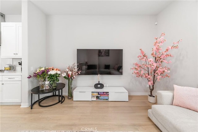 27218 Narrowleaf Willow Ln, Valencia, CA 91381 - living room with light wood-type flooring and baseboards