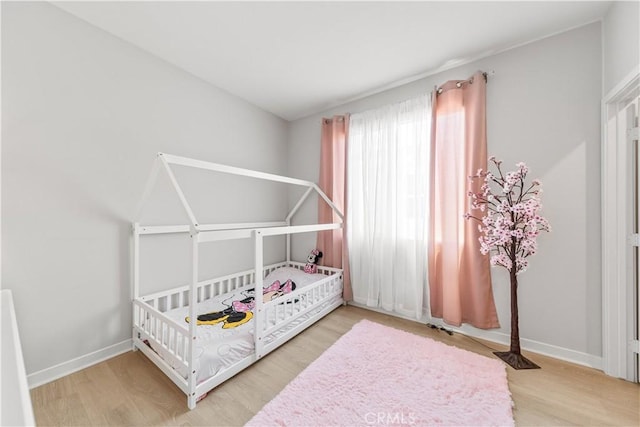 27218 Narrowleaf Willow Ln, Valencia, CA 91381 - bedroom featuring wood finished floors and baseboards