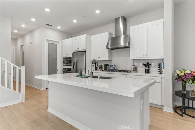 27218 Narrowleaf Willow Ln, Valencia, CA 91381 - kitchen with wall chimney exhaust hood, stainless steel refrigerator with ice dispenser, recessed lighting, light wood-type flooring, and white cabinetry