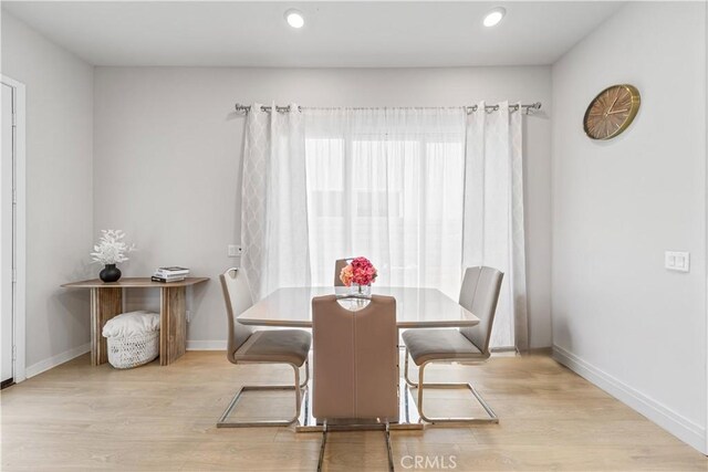 27218 Narrowleaf Willow Ln, Valencia, CA 91381 - dining space with wood finished floors, baseboards, and recessed lighting