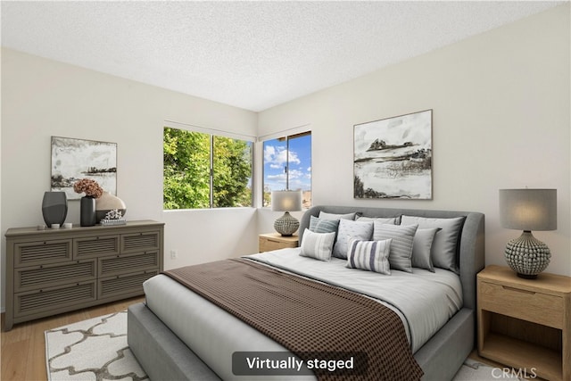 16925 Kemerton Pl, Hacienda Heights, CA 91745 - bedroom with wood finished floors and a textured ceiling