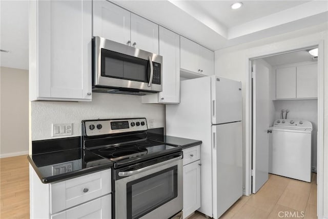 16925 Kemerton Pl, Hacienda Heights, CA 91745 - kitchen featuring appliances with stainless steel finishes, washer / dryer, dark countertops, white cabinets, and recessed lighting