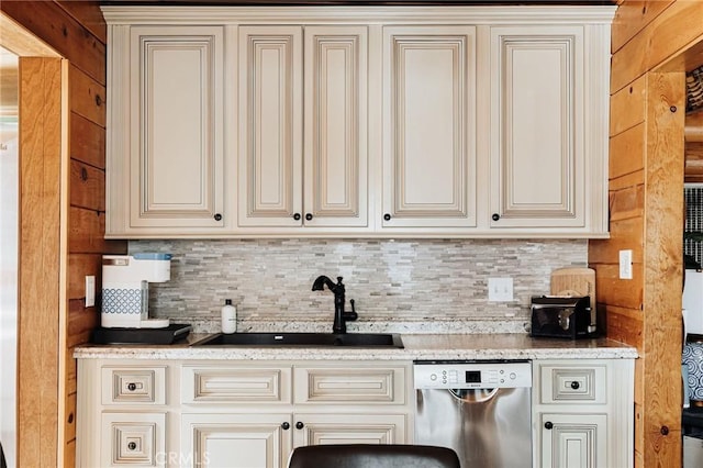 921 Anita Ave, Big Bear City, CA 92314 - kitchen featuring dishwasher, cream cabinetry, a sink, backsplash, and light stone countertops