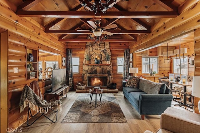 921 Anita Ave, Big Bear City, CA 92314 - living room with wood-type flooring, a ceiling fan, a stone fireplace, wood ceiling, and wooden walls
