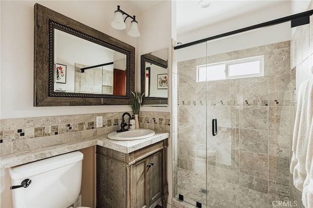 921 Anita Ave, Big Bear City, CA 92314 - full bath featuring tile walls, a shower stall, toilet, vanity, and wainscoting