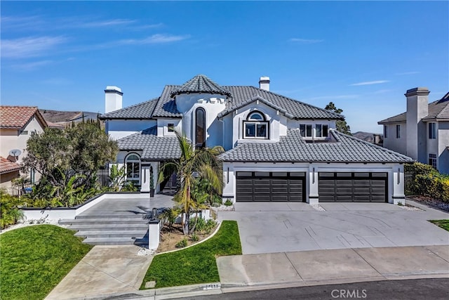 27055 Big Horn Mountain Way, Yorba Linda, CA 92887 - view of front of house featuring a tile roof, concrete driveway, stucco siding, and a chimney