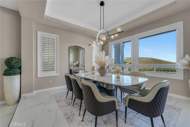 27055 Big Horn Mountain Way, Yorba Linda, CA 92887 - dining area with baseboards, marble look tile flooring, a chandelier, arched walkways, and a raised ceiling