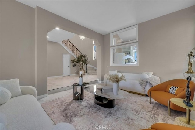 27055 Big Horn Mountain Way, Yorba Linda, CA 92887 - living room with stairs, marble look tiles, and baseboards