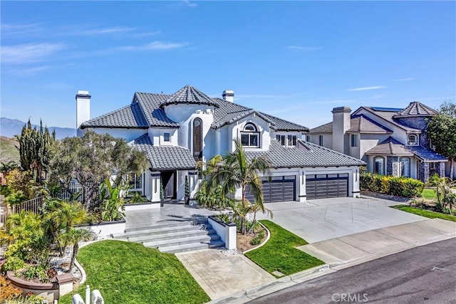 27055 Big Horn Mountain Way, Yorba Linda, CA 92887 - view of front of house featuring a chimney, a tile roof, driveway, an attached garage, and stucco siding