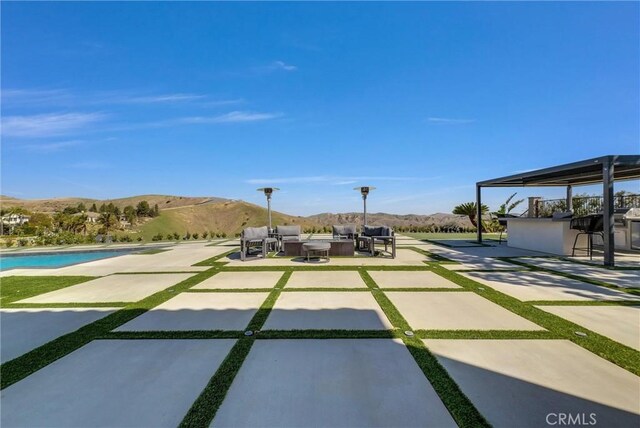 27055 Big Horn Mountain Way, Yorba Linda, CA 92887 - view of patio with a mountain view, an outdoor living space, a pool, and a grill