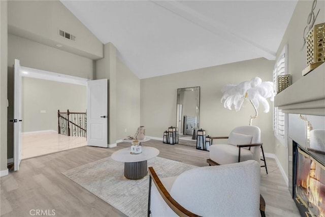 27055 Big Horn Mountain Way, Yorba Linda, CA 92887 - living room with high vaulted ceiling, light wood-style floors, and baseboards