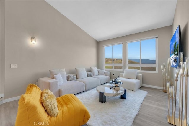 27055 Big Horn Mountain Way, Yorba Linda, CA 92887 - living room with baseboards, light wood-type flooring, and vaulted ceiling