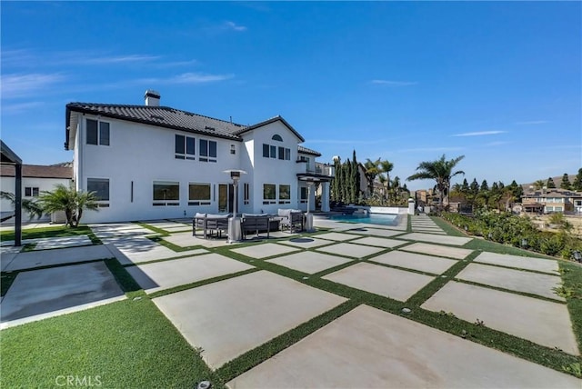 27055 Big Horn Mountain Way, Yorba Linda, CA 92887 - back of house with a pergola, an outdoor hangout area, a chimney, an outdoor pool, and a patio area