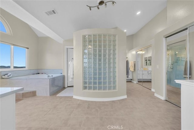 27055 Big Horn Mountain Way, Yorba Linda, CA 92887 - bathroom featuring a stall shower, a garden tub, tile patterned flooring, lofted ceiling, and baseboards