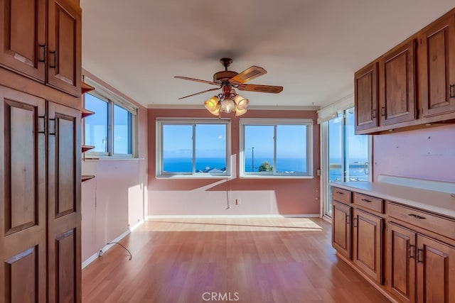 1947 Palacios Dr, San Pedro, CA 90732 - kitchen featuring a ceiling fan, baseboards, brown cabinets, and light wood finished floors