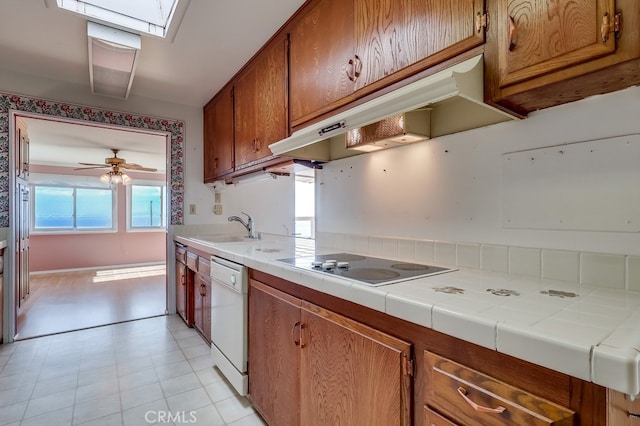 1947 Palacios Dr, San Pedro, CA 90732 - kitchen featuring white dishwasher, a sink, electric cooktop, and brown cabinetry