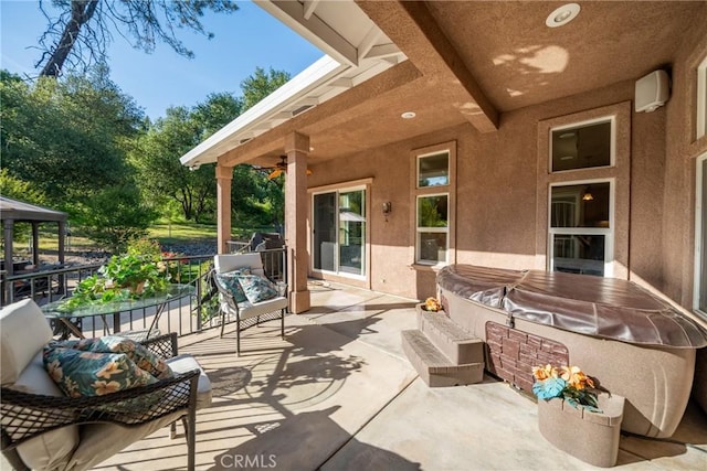 view of patio / terrace featuring a hot tub