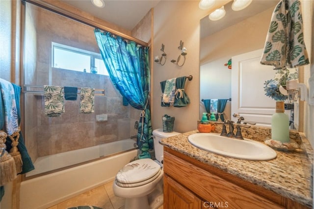 bathroom with toilet, shower / tub combo with curtain, vanity, and tile patterned flooring