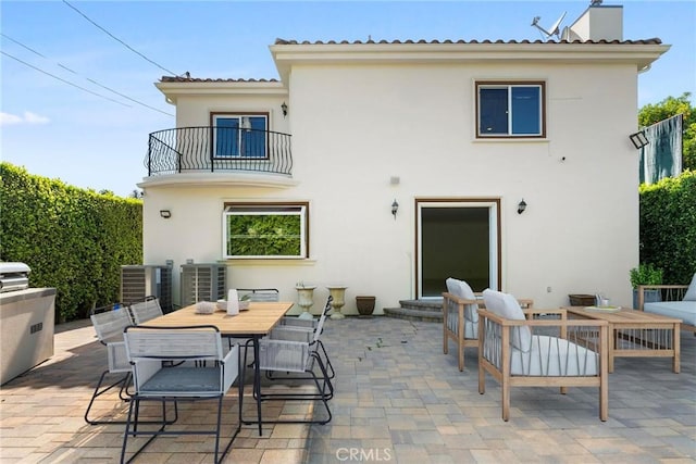 4818 Lemona Ave, Sherman Oaks, CA 91403 - back of house with a balcony, stucco siding, a patio, and central AC