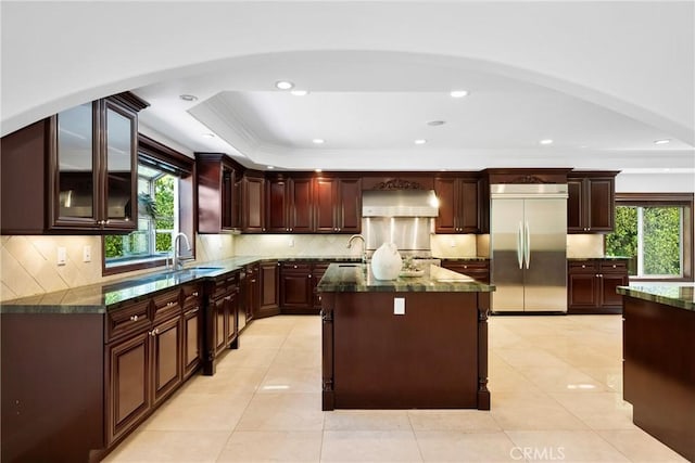 4818 Lemona Ave, Sherman Oaks, CA 91403 - kitchen with stainless steel built in fridge, a sink, healthy amount of natural light, range hood, and ornamental molding