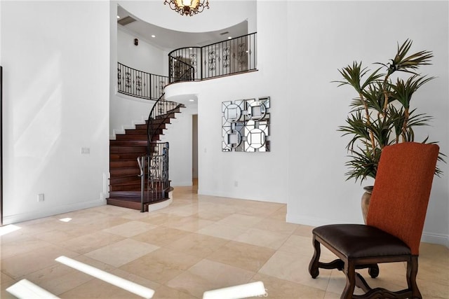4818 Lemona Ave, Sherman Oaks, CA 91403 - stairway featuring a high ceiling, baseboards, and a chandelier