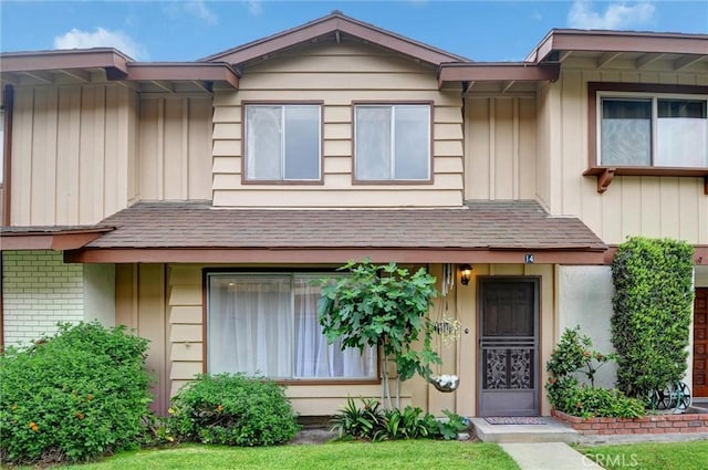 11000 Woodruff Ave Unit 14, Downey, CA 90241 - townhome / multi-family property with brick siding and board and batten siding