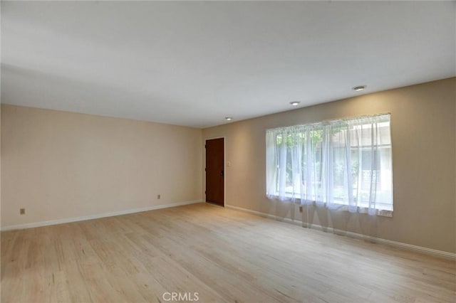 11000 Woodruff Ave Unit 14, Downey, CA 90241 - empty room with light wood-type flooring and baseboards