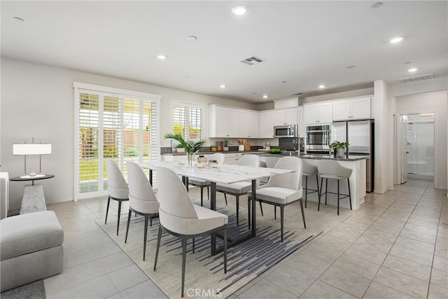 1004 Violet Ct, Calimesa, CA 92320 - dining space with light tile patterned floors, recessed lighting, and baseboards
