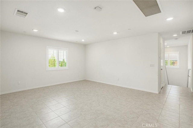 1004 Violet Ct, Calimesa, CA 92320 - empty room with healthy amount of natural light, recessed lighting, baseboards, and light tile patterned floors