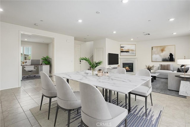 1004 Violet Ct, Calimesa, CA 92320 - dining space featuring a glass covered fireplace, light tile patterned flooring, recessed lighting, an office area, and baseboards