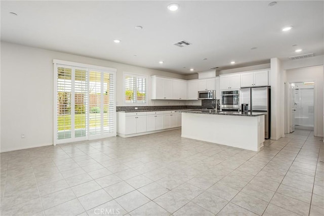 1004 Violet Ct, Calimesa, CA 92320 - kitchen featuring appliances with stainless steel finishes, a sink, open floor plan, light tile patterned floors, and recessed lighting