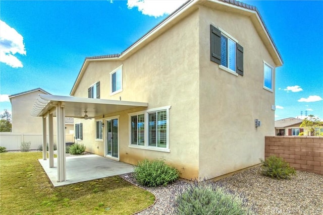 1004 Violet Ct, Calimesa, CA 92320 - back of house featuring a ceiling fan, stucco siding, and a patio