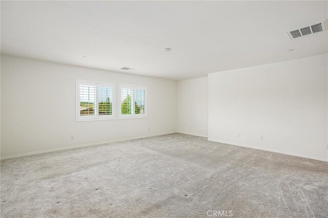 1004 Violet Ct, Calimesa, CA 92320 - carpeted spare room with baseboards
