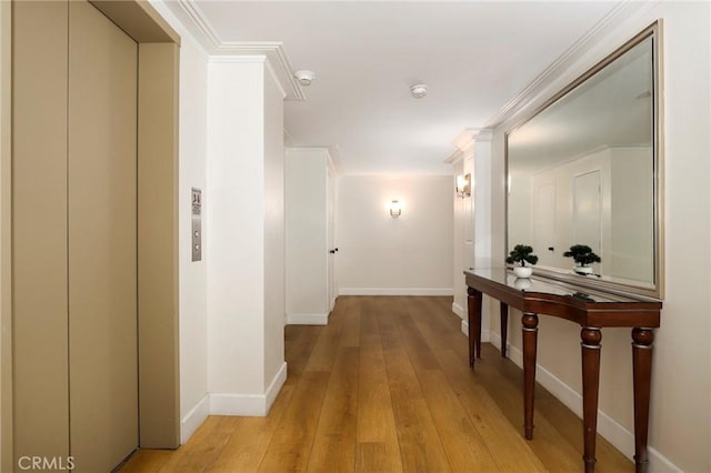 321 N Oakhurst Dr Unit 404, Beverly Hills, CA 90210 - hallway featuring elevator, light wood-type flooring, and baseboards