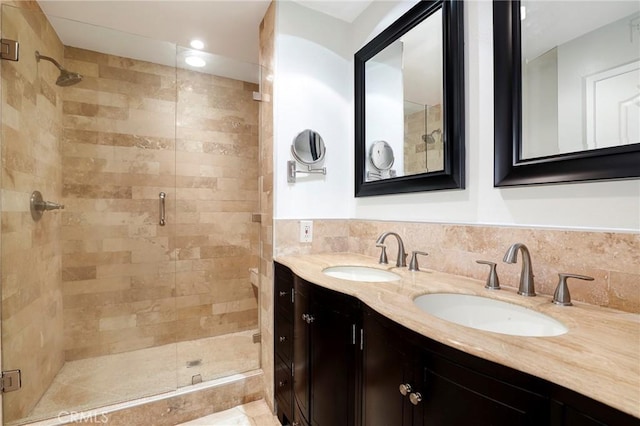 321 N Oakhurst Dr Unit 404, Beverly Hills, CA 90210 - full bathroom with a stall shower, double vanity, and backsplash