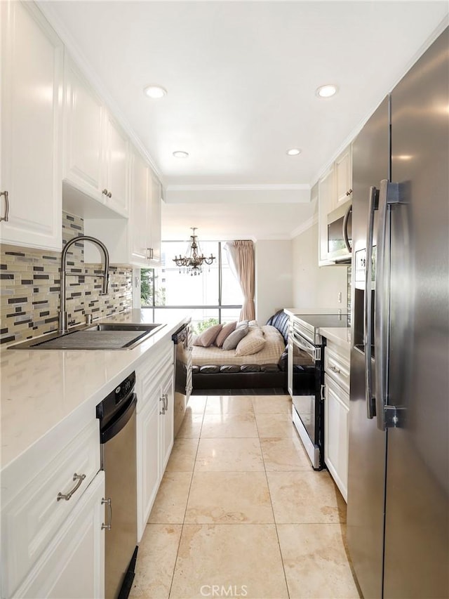 321 N Oakhurst Dr Unit 404, Beverly Hills, CA 90210 - kitchen with appliances with stainless steel finishes, a sink, white cabinetry, light countertops, and backsplash