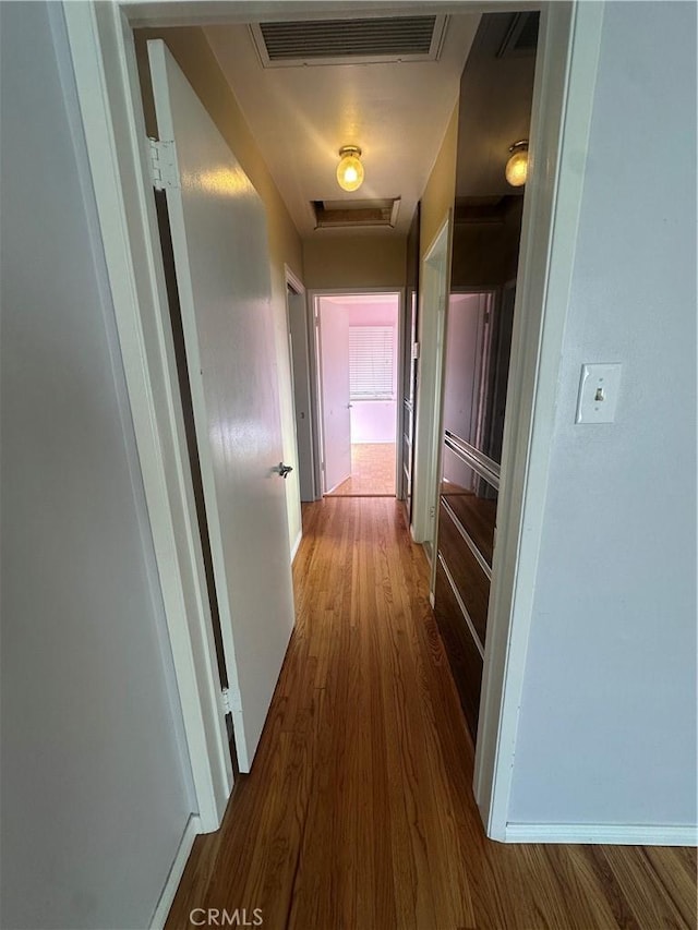 7918 Kyle St, Sunland, CA 91040 - corridor featuring wood finished floors and attic access