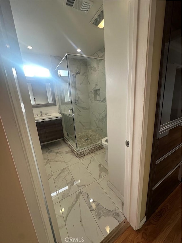 7918 Kyle St, Sunland, CA 91040 - full bathroom with marble look tile flooring, toilet, a marble finish shower, vanity, and recessed lighting