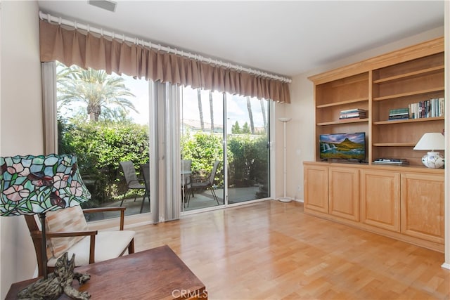 living area with light wood-style floors