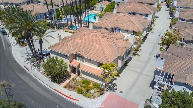 aerial perspective of suburban area featuring a pool area