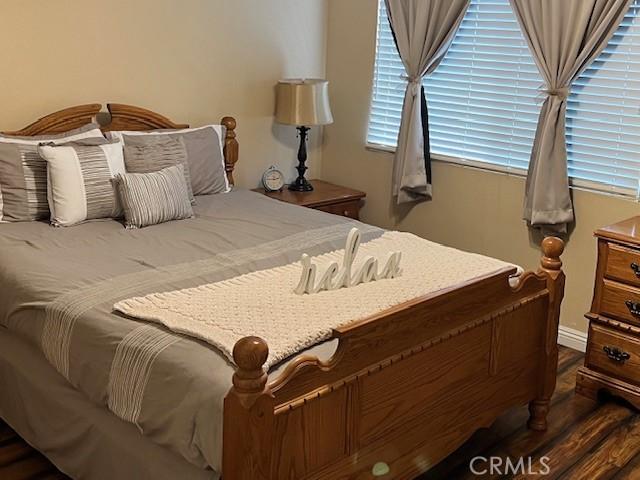 bedroom featuring wood finished floors
