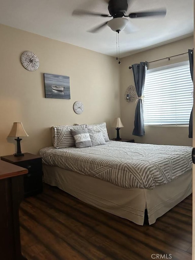 bedroom featuring wood finished floors and ceiling fan