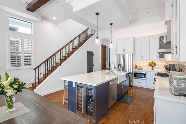 1715 Reed St, Redondo Beach, CA 90278 - kitchen with wine cooler, appliances with stainless steel finishes, dark wood-style flooring, white cabinetry, and tasteful backsplash