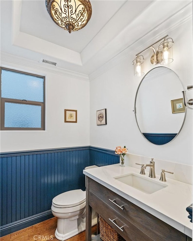 1715 Reed St, Redondo Beach, CA 90278 - bathroom with vanity, a wainscoted wall, wood finished floors, and a tray ceiling