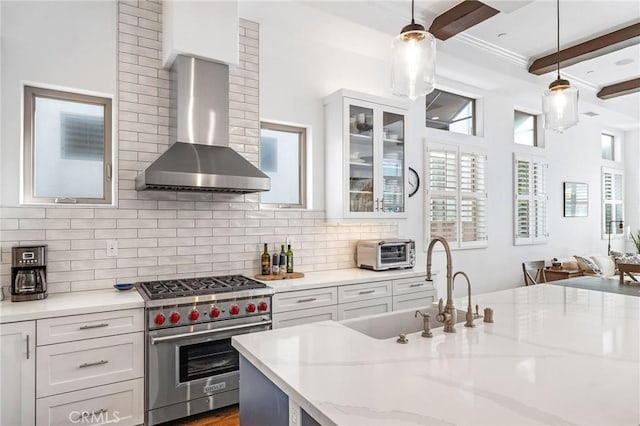 1715 Reed St, Redondo Beach, CA 90278 - kitchen featuring designer range, wall chimney range hood, white cabinets, glass insert cabinets, and tasteful backsplash